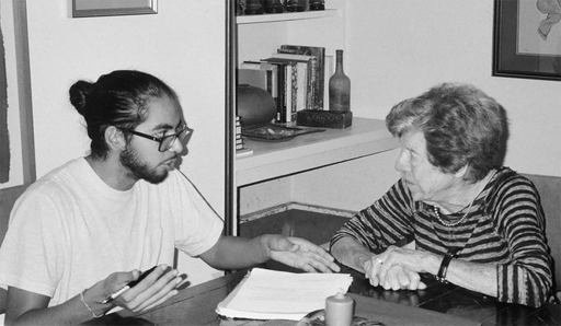 Benji de la Piedra explains an interview legal release with Jean Gordon, former member of the Little Rock School Board and founder of the Arkansas chapter of Women's Action for New Directions. Credit: Sebi Harrigan-Labarca